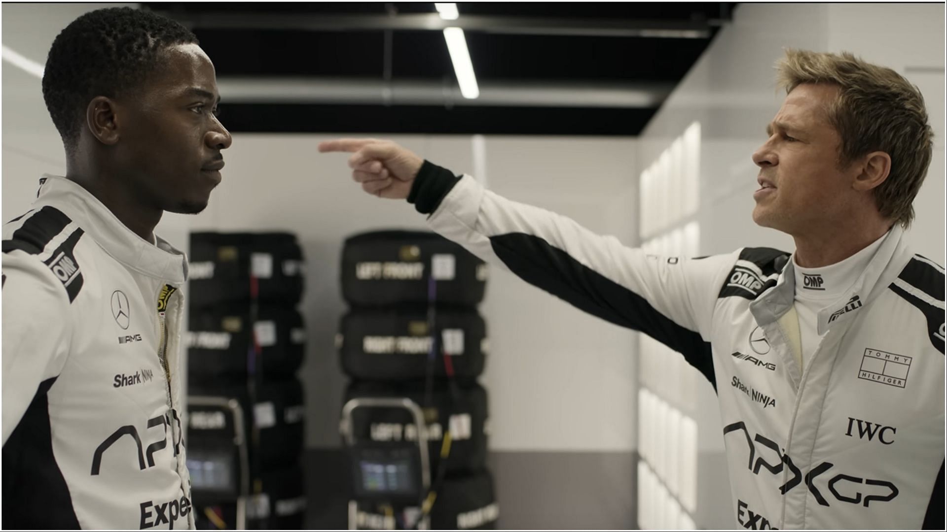 The Movie, portraying an intense moment between rookie driver Joshua Pearce and mentor Sonny Hayes. (Image via AppleTv)